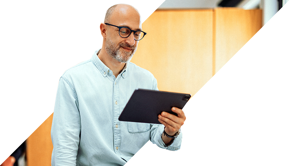 home-about-ukom man using tablet at work