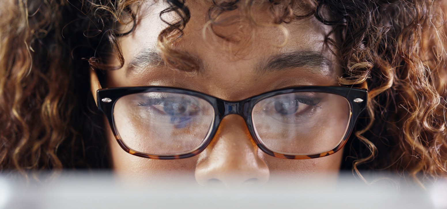 Understanding Journeys A woman looks over a laptop screen